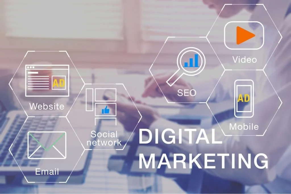 A man works at his computer for a marketing agency in Sacramento and, in the foreground, a graphic shows different aspects of digital marketing.